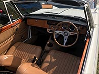 Very stylish tan vinyl / wood interior